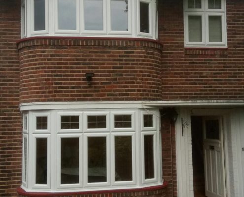 ENFIELD - BAY WINDOWS WITH DUMMY SASH AND LEAD DESIGN IN FANLIGHTS
