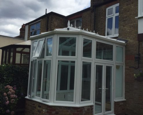 Flush sash Conservatory fitted with blue active roof glass in Southgate felt roof re done