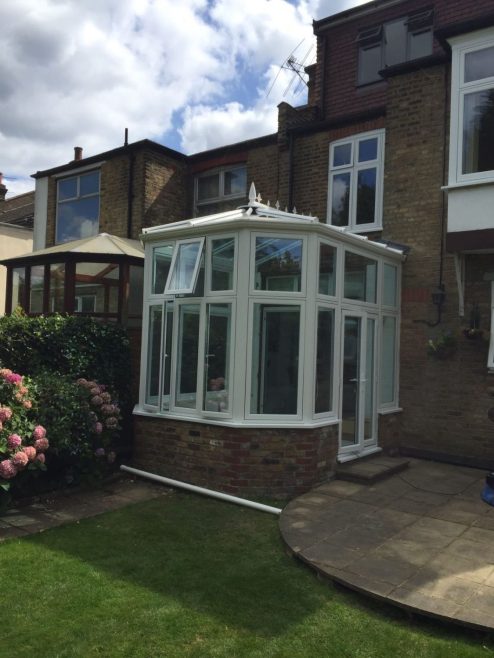 Flush sash Conservatory fitted with blue active roof glass in Southgate felt roof re done